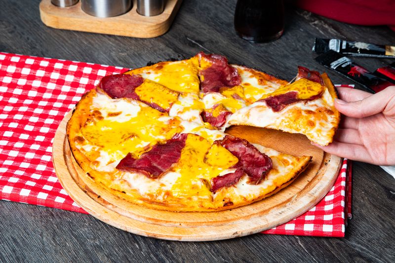 Meat lovers pizza loaded with toppings at pizzafactory